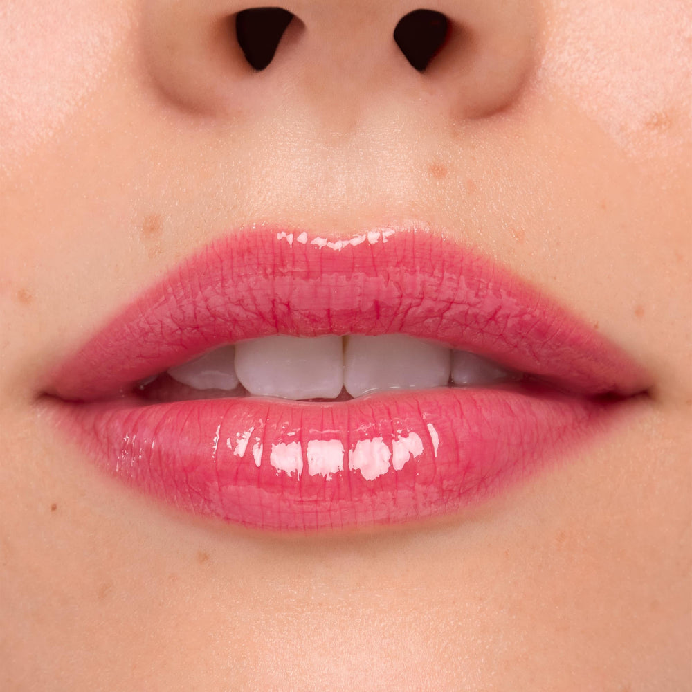 ColourPop Stitch lip gloss in sheer hot pink for everyday glamour.