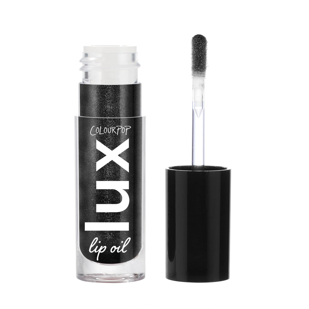 ColourPop Twilight Lux Lip Oil bottle cap close-up showing hydration.