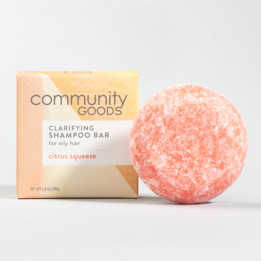 Community Goods Citrus Squeeze Shampoo Bar packaging showcases recyclable materials for eco-conscious shoppers.