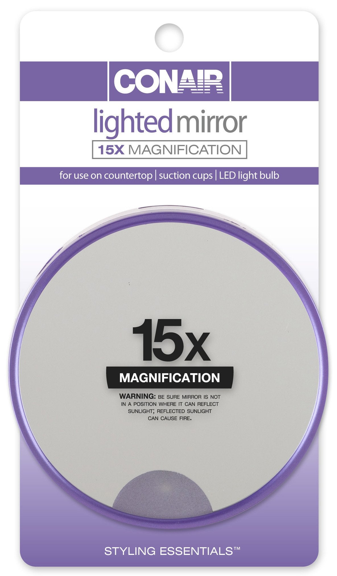 Conair 15x magnification lighted suction mirror attached to a smooth surface for precise makeup detail