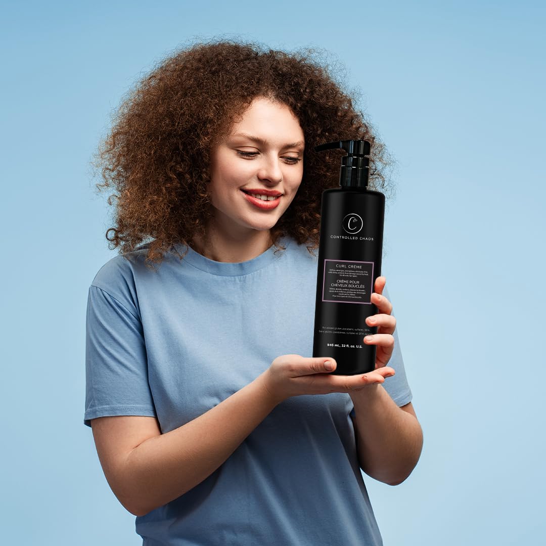Shiny, defined curls with Controlled Chaos Curl Cream for frizz-free waves.
