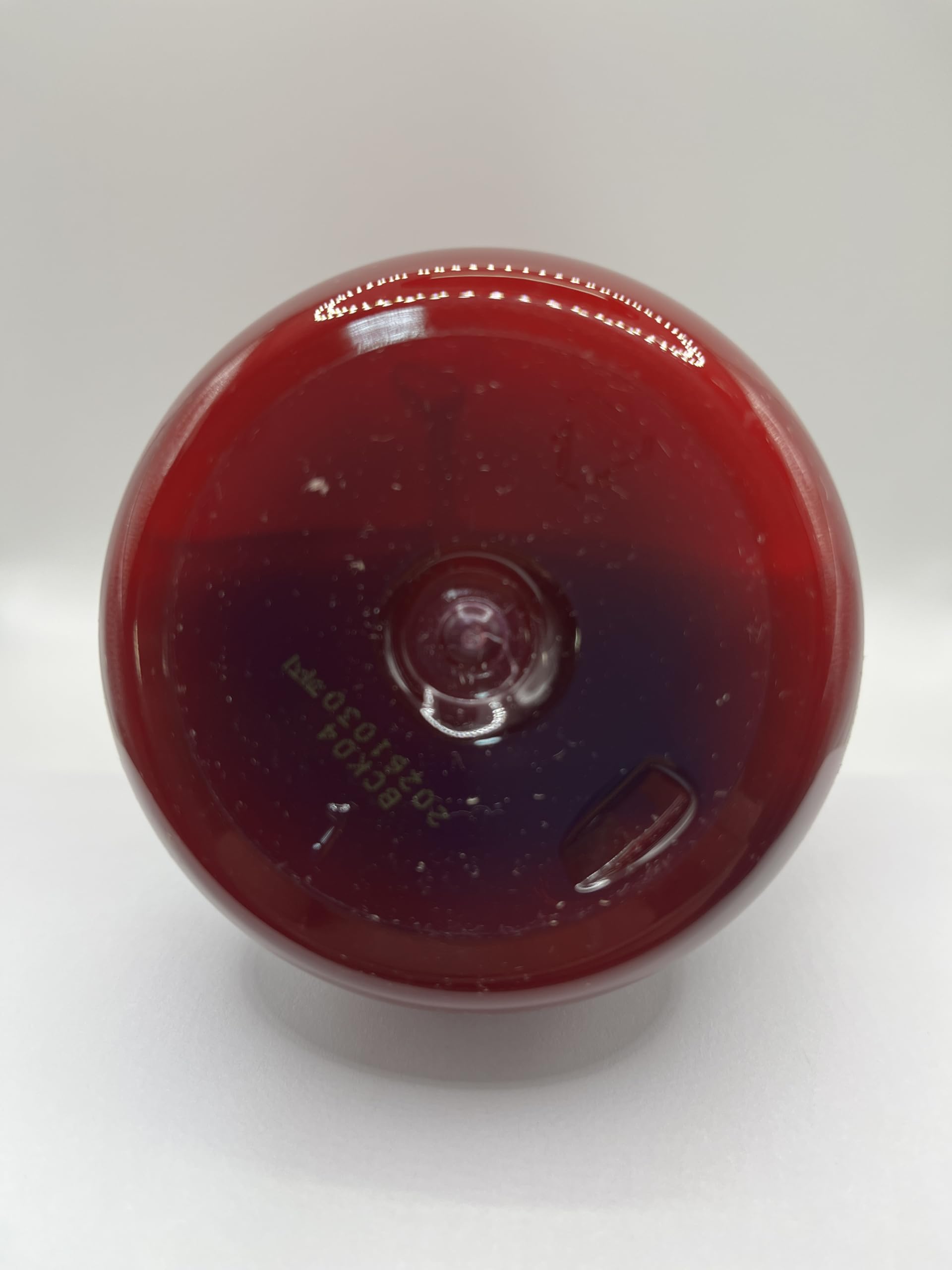 COSMOCOS REDFLO 700 ml bottle on shelf.