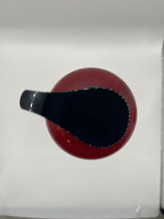 COSMOCOS REDFLO made in South Korea label on bottle.