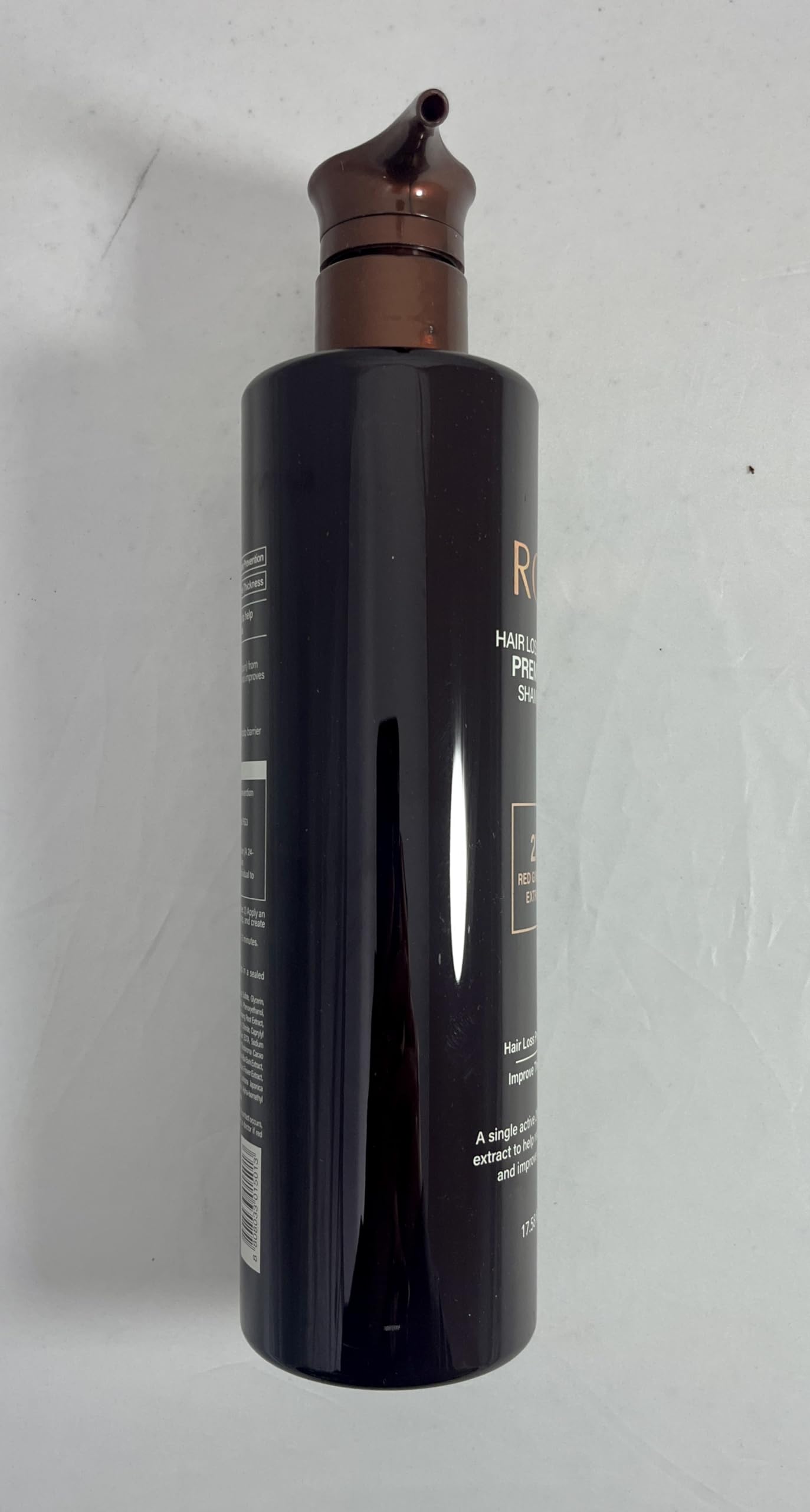 COSMOCOS RG3 bottle suggests stronger-looking hair strands.