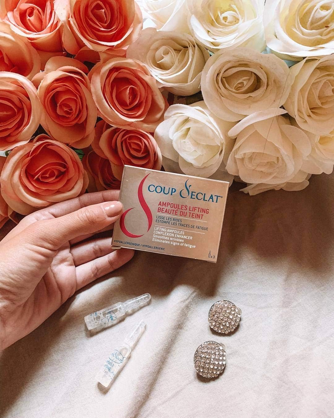 Applying Coup d'Eclat ampoules for an instant lifting effect