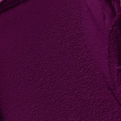 CoverGirl Exhibitionist application closeup highlights smooth glide and moisturizing finish.