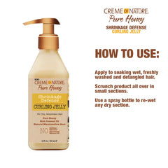 Hands applying Creme of Nature Curling Jelly to detangle and control frizz.
