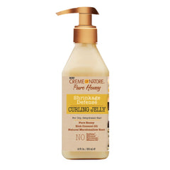 Creme of Nature Curling Jelly bottle close-up showing defined curls and shine.