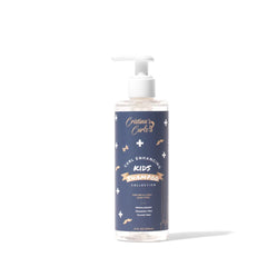 Cristina's Curls Kids Shampoo bottle pour, gentle cleansing and hydration.
