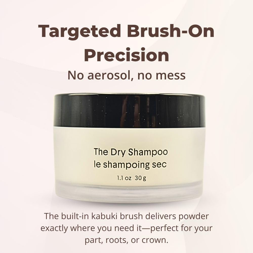 Crown Affair dry shampoo kabuki brush close-up applying powder to roots.