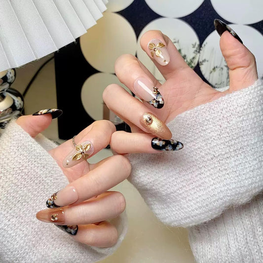 CTTHNBD almond nails black gold design closeup highlights bold style for events.
