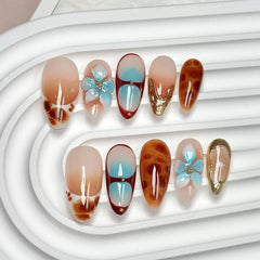 CTTHNBD medium almond press-on nails with flower gold line design for easy at-home manicure