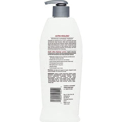 Hand applying Curel Ultra Healing Lotion to rough areas for deep hydration