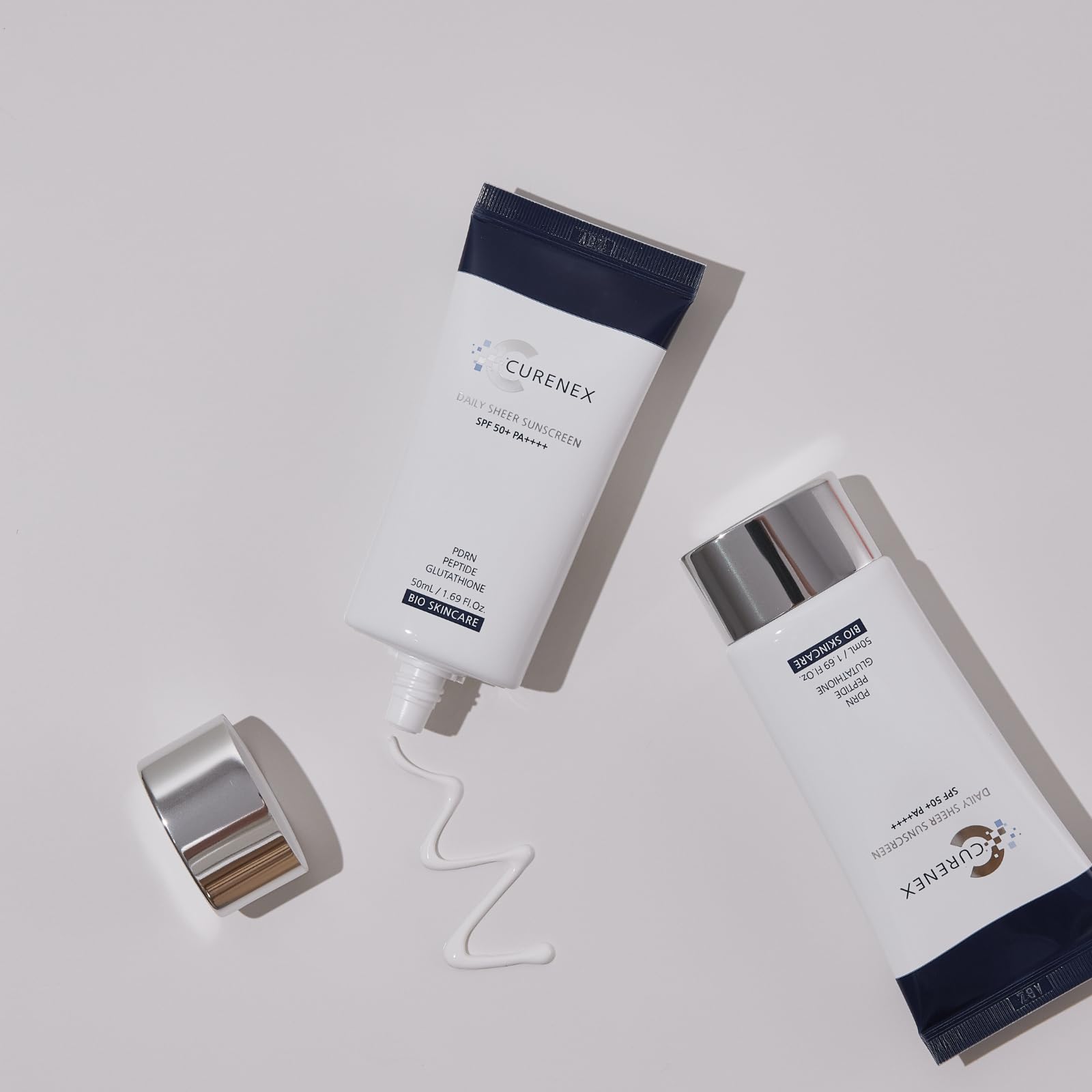 CURENEX Daily Sheer sunscreen bottle with pump supports easy reapplication.