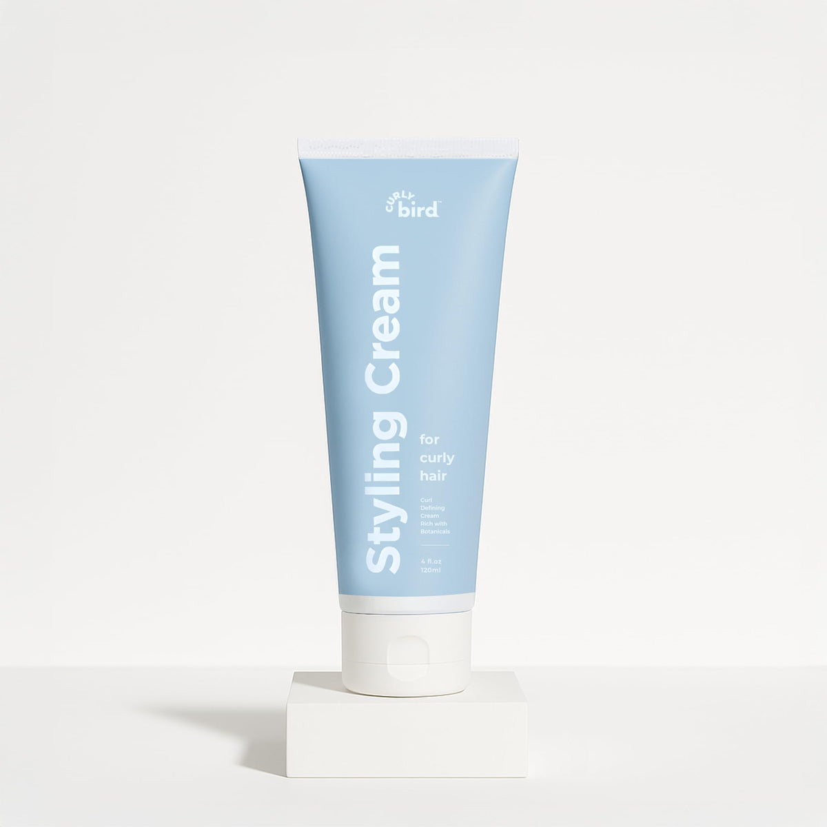 Curly Bird Curl Defining Styling Cream bottle for easy application
