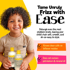 Child brushing curly hair with CurlyKids to ease detangling.