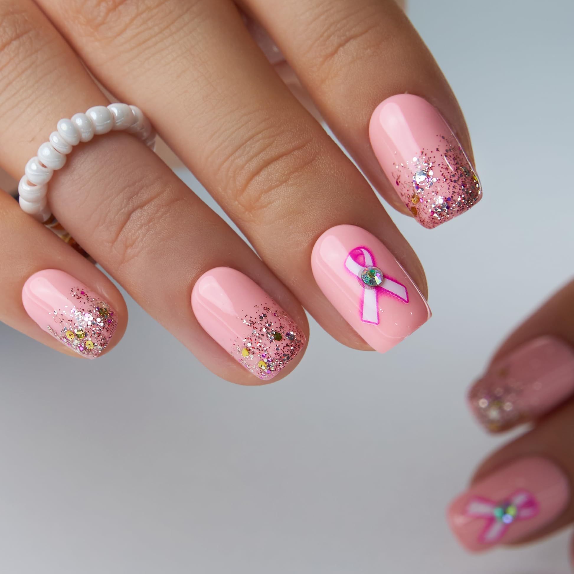 Curvlife base color gel with decorative accents for salon-style nails.
