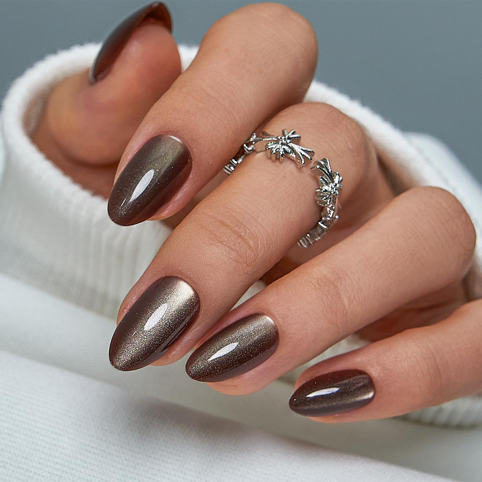 CurvLife Bronze MoCa cat eye nails collection in medium almond for chic everyday wear.