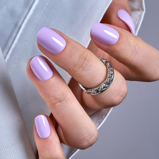 CurvLife oval press-on nails short close-up showing natural fit and glossy finish.