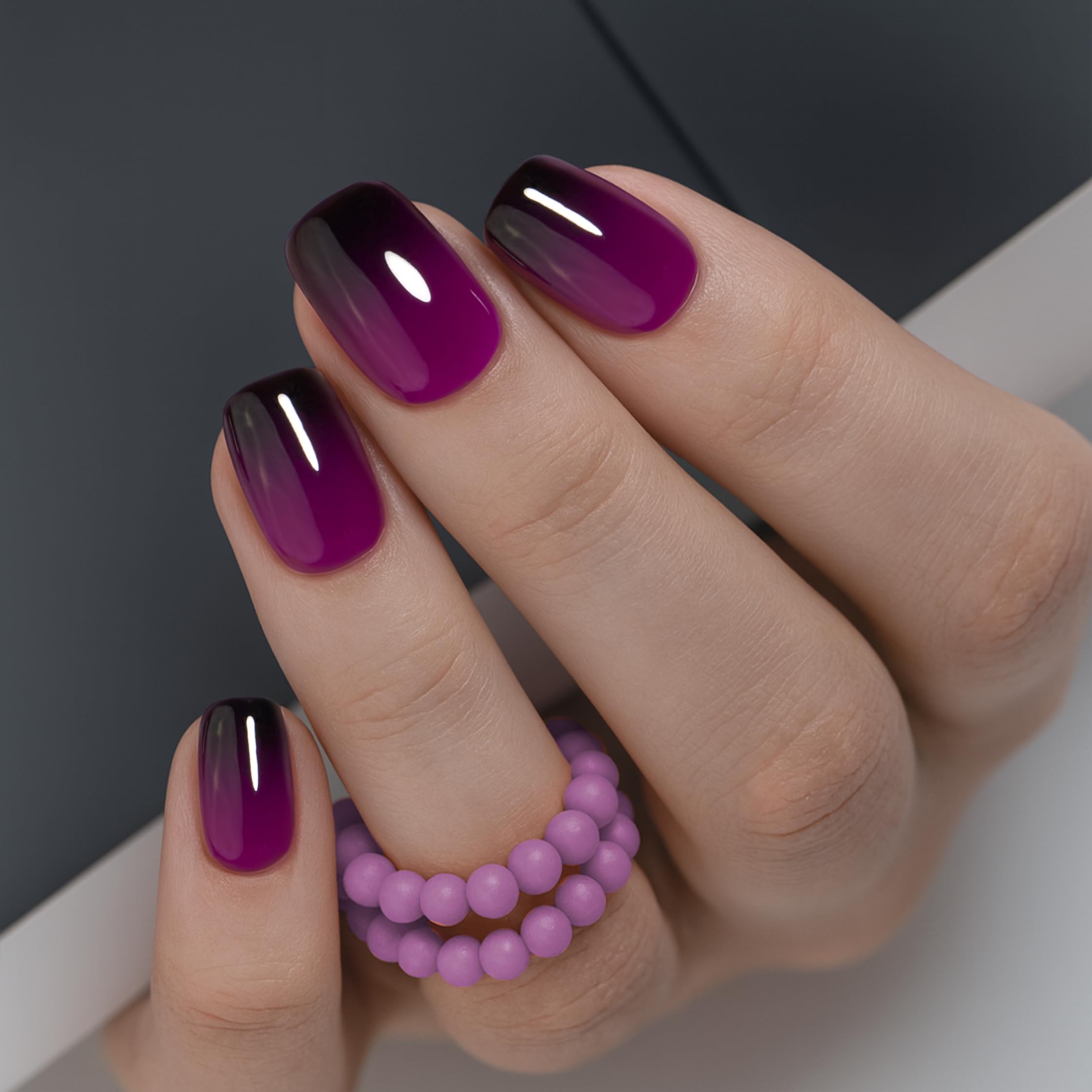 Curvlife press-on nails in grayish purple closeup showing sleek gel finish.