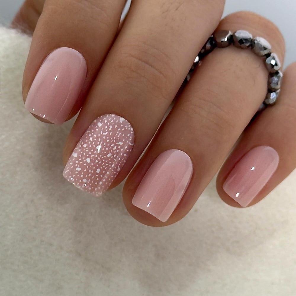 Curvlife pink short square snowflake glitter nails for winter events.