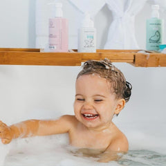 Dabble & Dollop body wash lather around kids with soothing coconut-vanilla scent.