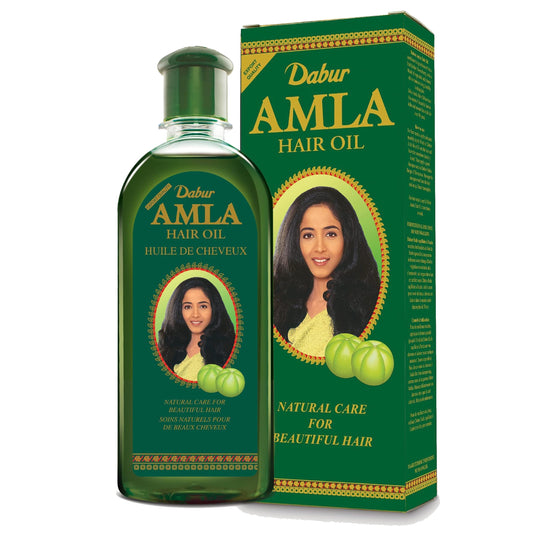 Dabur Amla Hair Oil bottle 500ml on display for nourishing scalp use.
