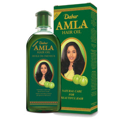 Dabur Amla Hair Oil bottle 500ml on display for nourishing scalp use.