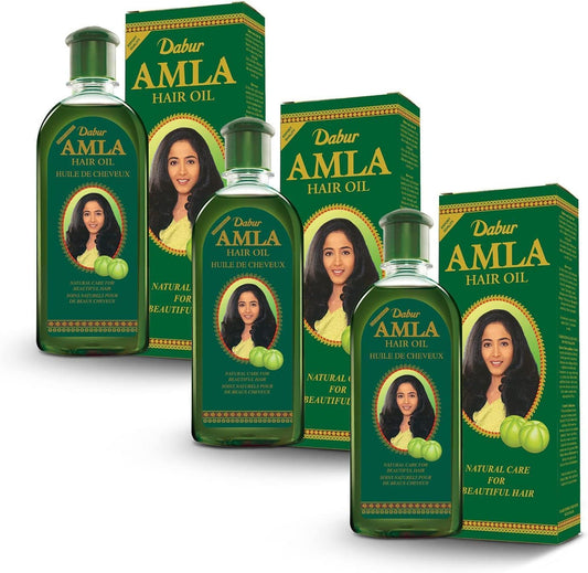 Dabur Amla Hair Oil bottle display highlighting the herbal formula for nourished scalp.