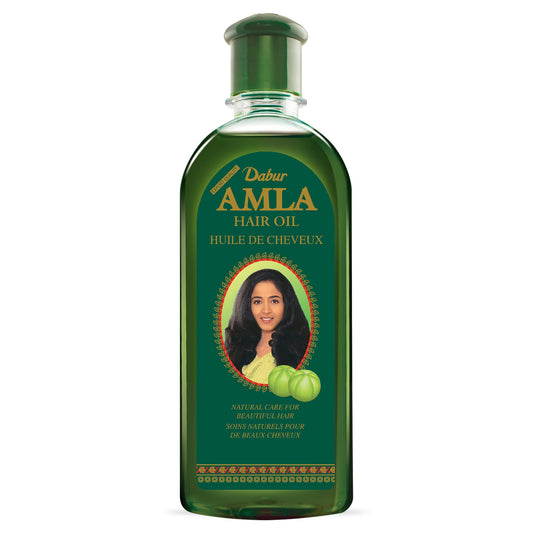 Dabur Amla Hair Oil pour demonstrates smooth, even scalp coverage.