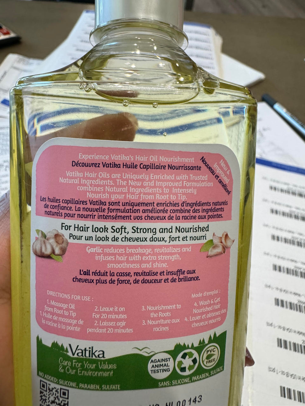 Dabur Vatika Enriched Hair Oil application on hair for daily nourishment.