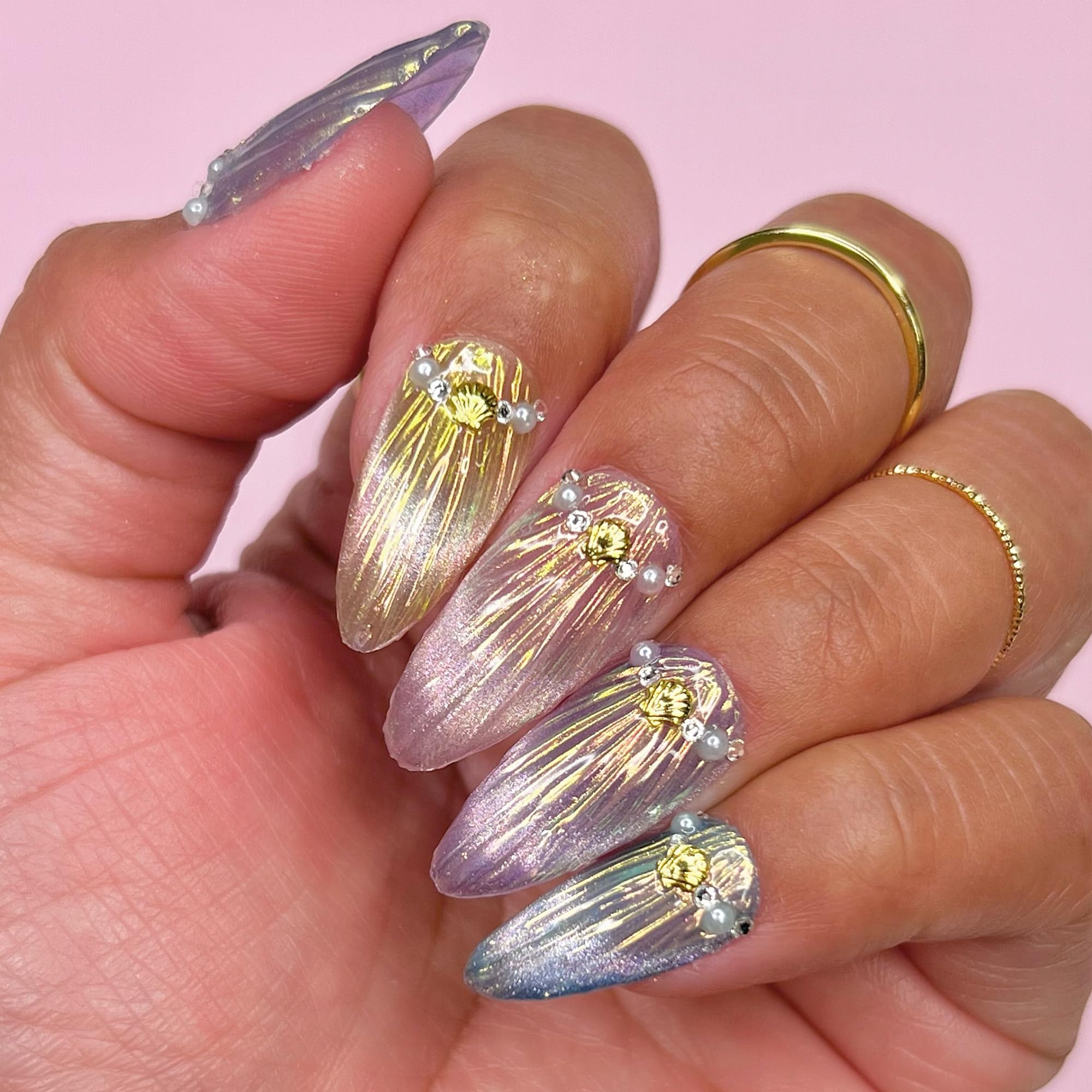 Daily Charme chrome powders paired with no-wipe gel for chrome effects at home