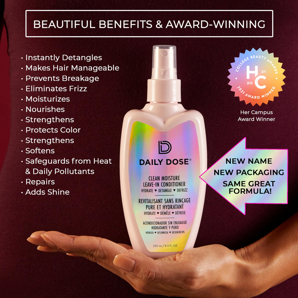 DAILY DOSE spray nozzle close-up emphasizing easy detangling on damp hair.
