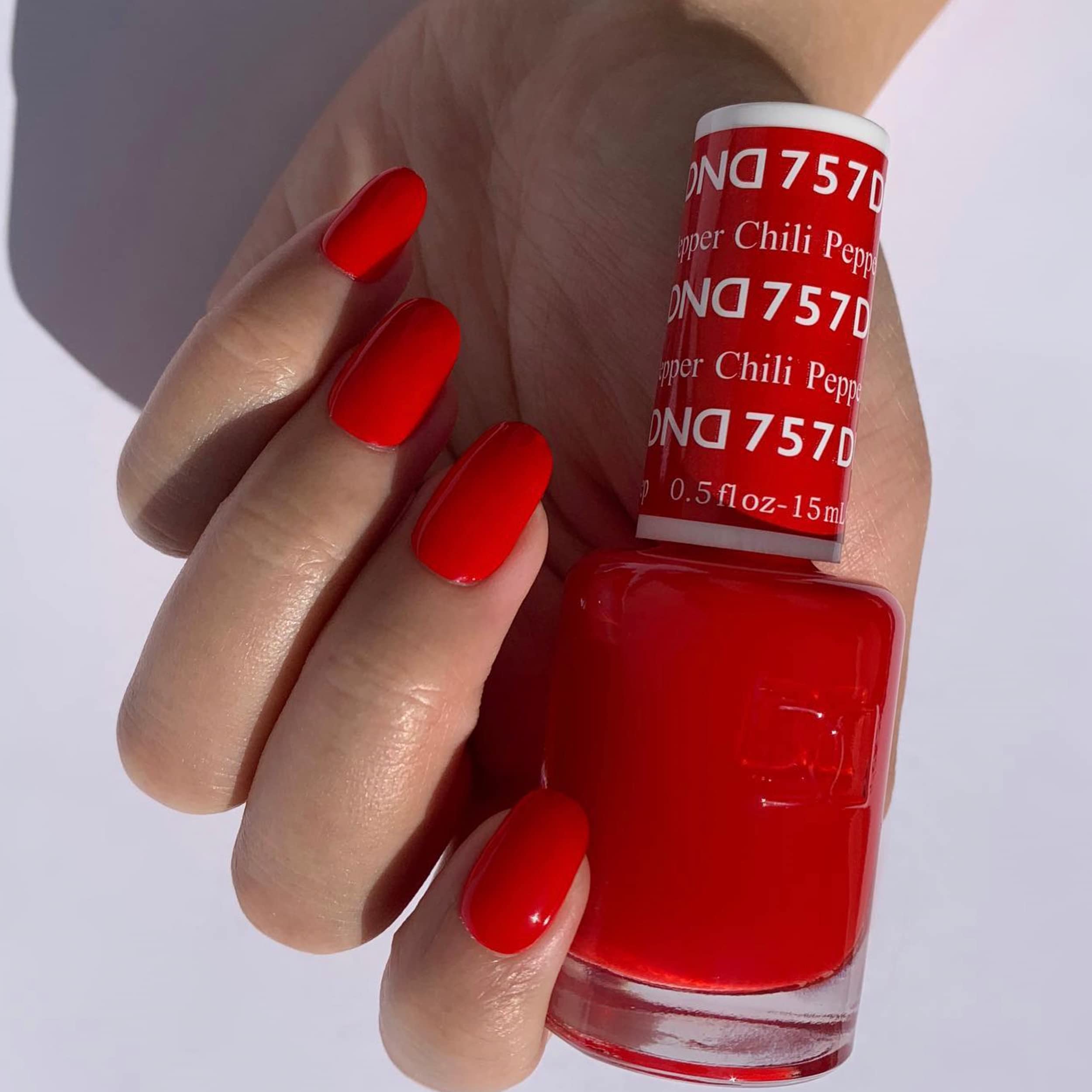 DAISY DND Chili Pepper lacquer bottle complements the gel for a seamless color duo.