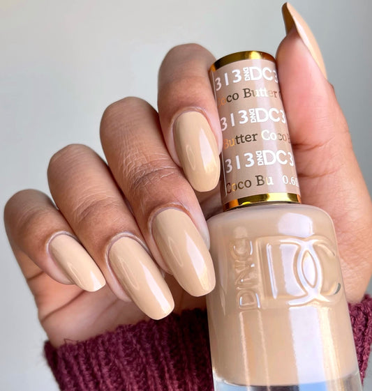 Daisy DND Coco Butter lacquer bottle matches the gel color for a cohesive look.