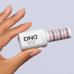 DAISY DND Soft Tulips lacquer bottle closeup revealing color-matched shine for at-home nails.