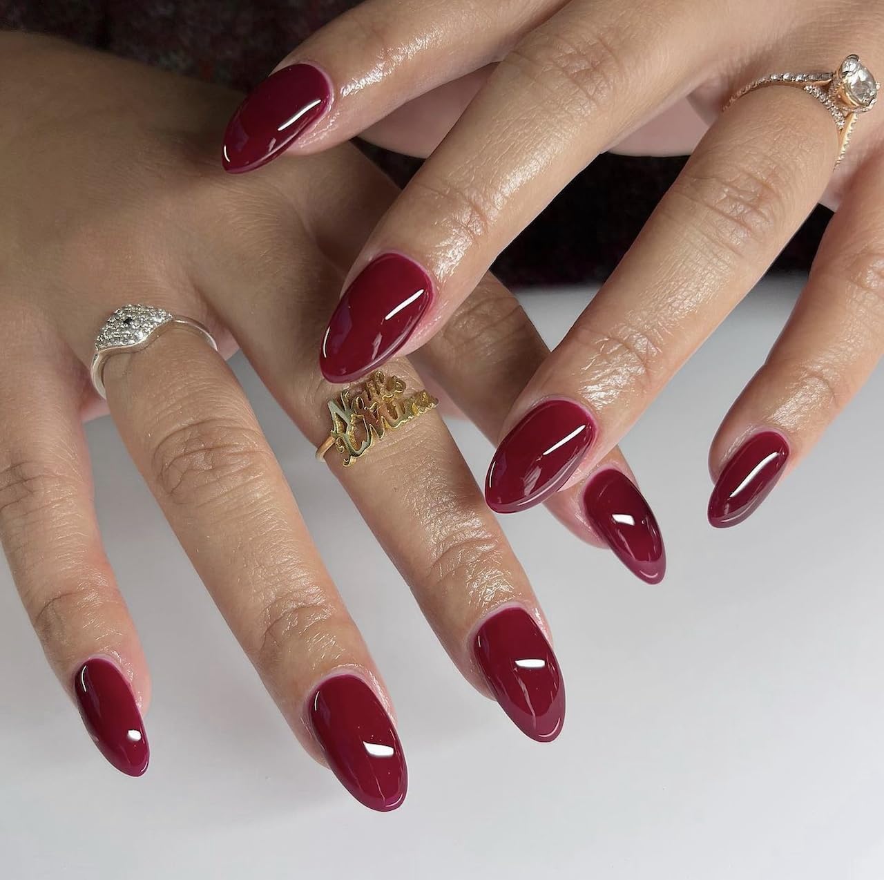 Daisy DND Wineberry duo swatch display demonstrates coordinated color for a cohesive manicure.