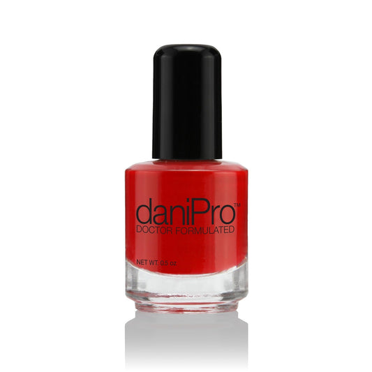 daniPro First Kiss bottle front with bold red nail polish shade