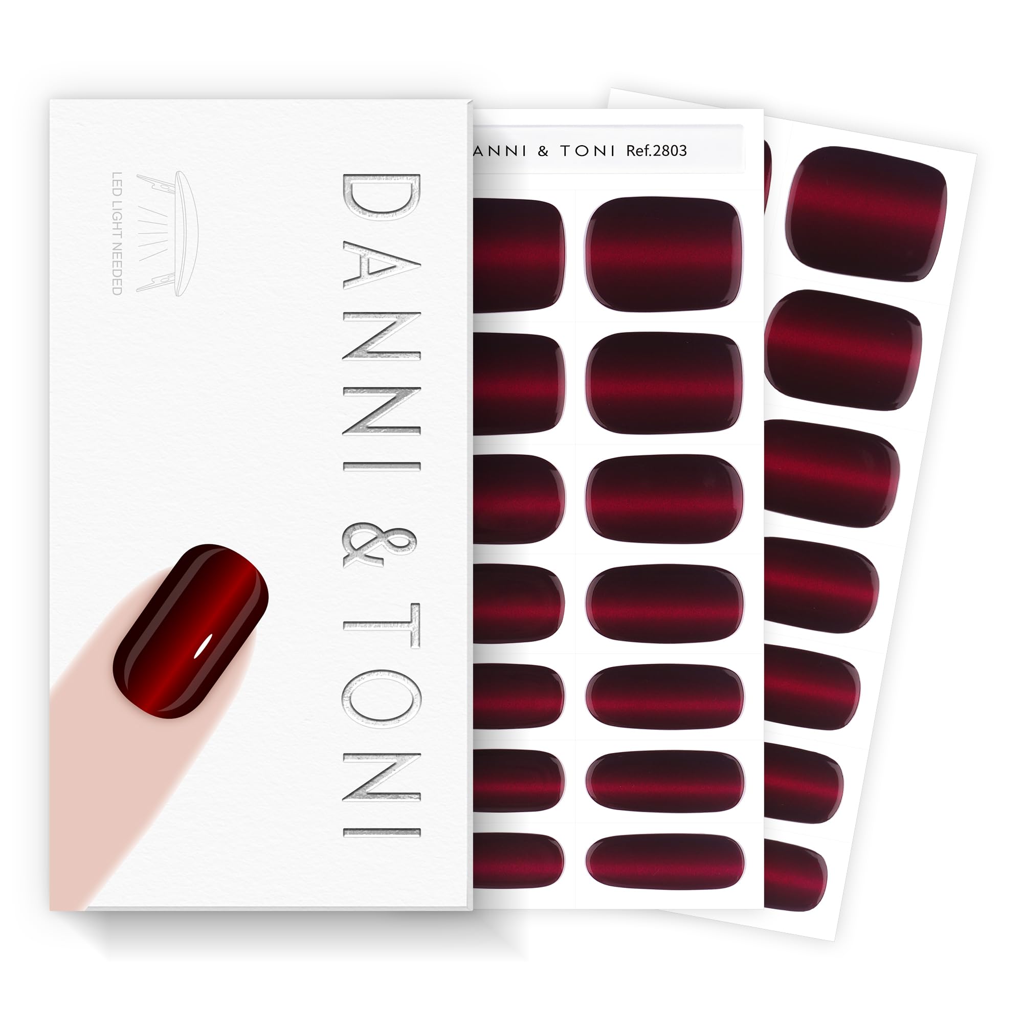 DANNI & TONI crimson eclipse cat-eye wraps for a bold manicure.