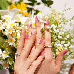 Nail being cured under UV light with Pink Cat Eye Butterfly design