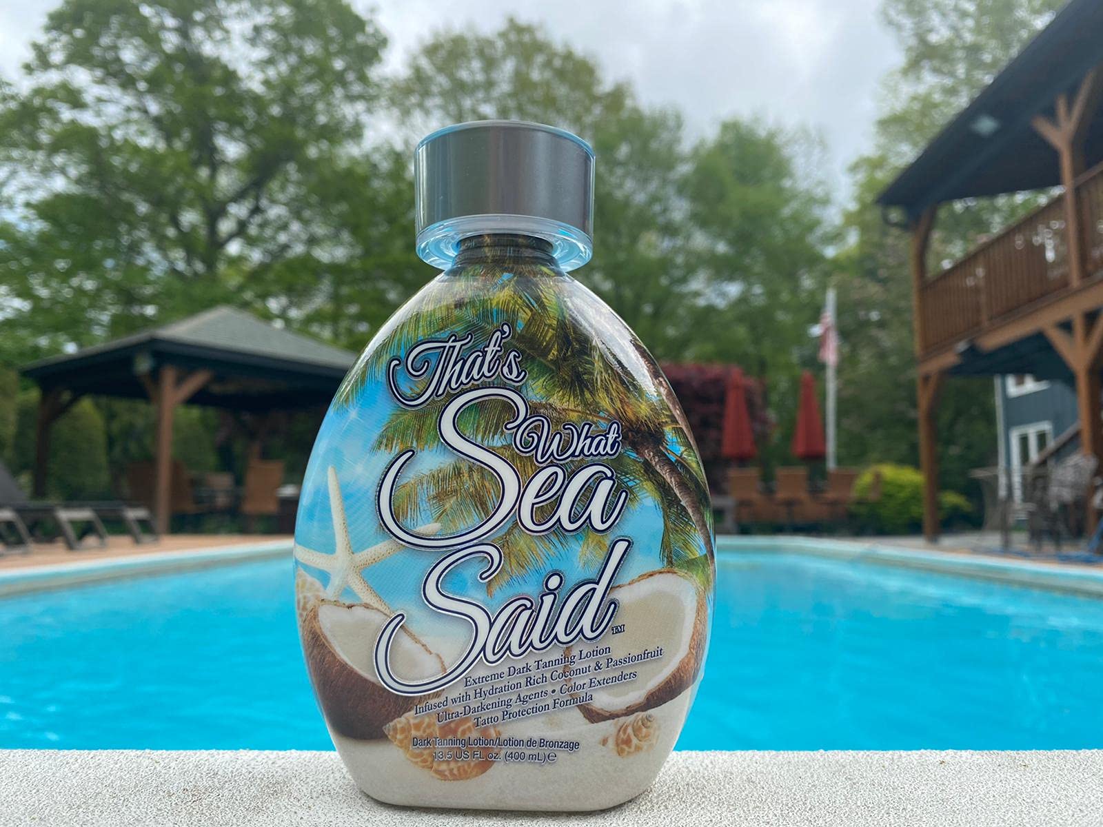 DARK TANS EXCLUSIVE Outdoor beach scene highlighting natural bronze glow.