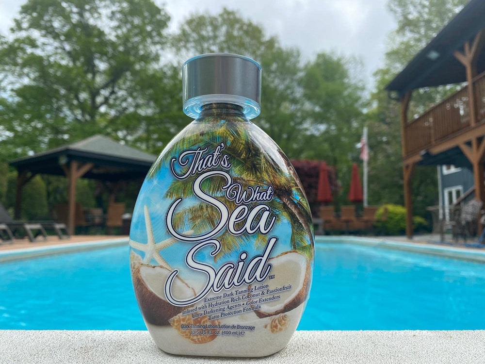 DARK TANS EXCLUSIVE Outdoor beach scene highlighting natural bronze glow.