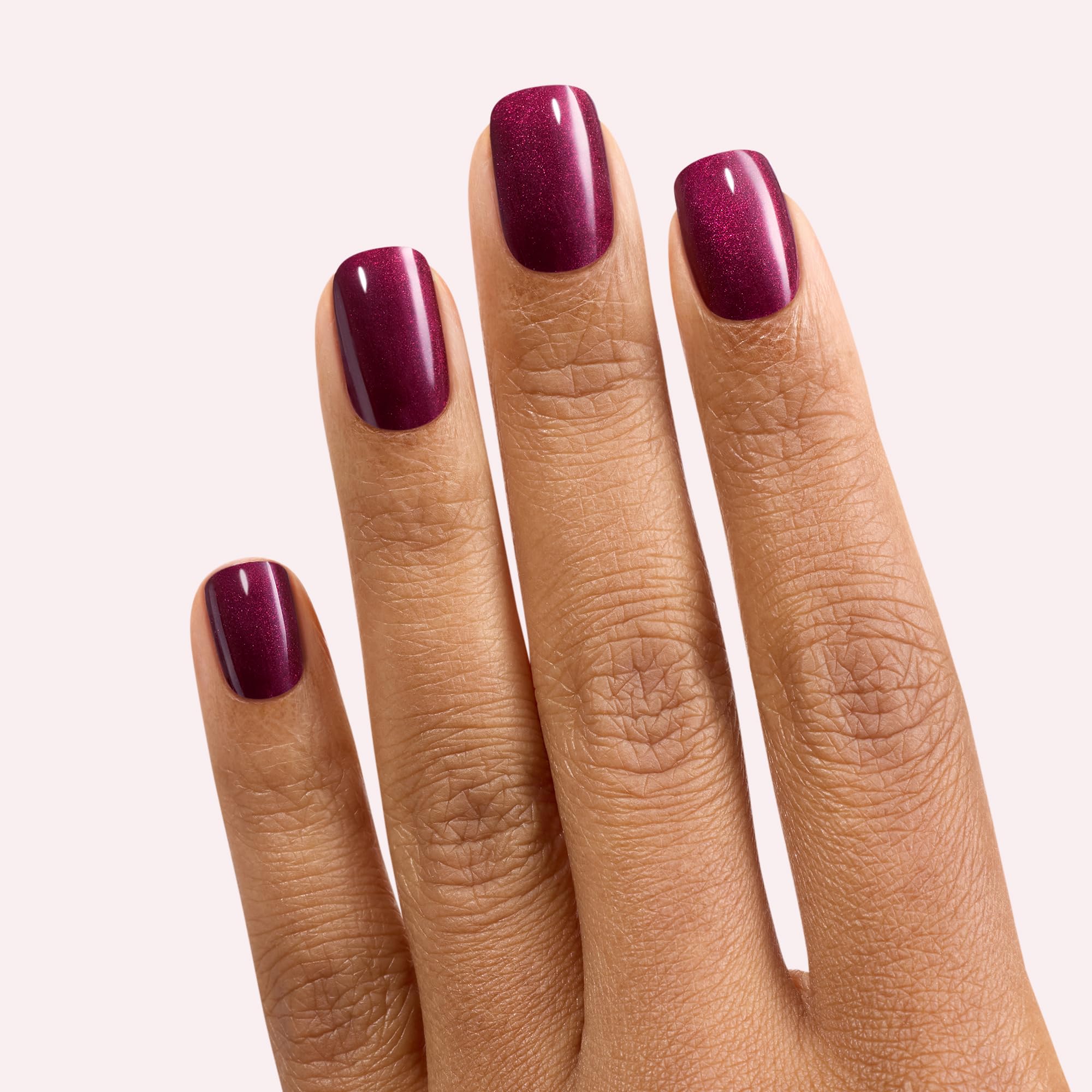 Close-up of Dashing Diva Attention gloss nail strip in bold red shade.