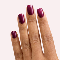 Close-up of Dashing Diva Attention gloss nail strip in bold red shade.