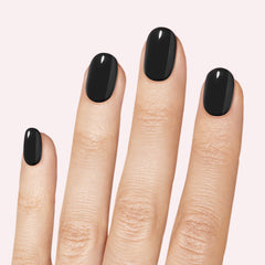 Closeup of applying Dashing Diva Gloss nail strips for quick, press-and-go manicure.