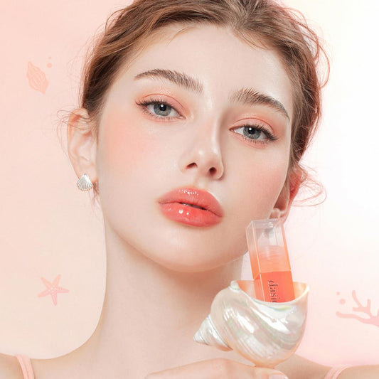 Dasique Juicy Dewy Tint Orange Coke on lips shows sheer color with moisturizing shine