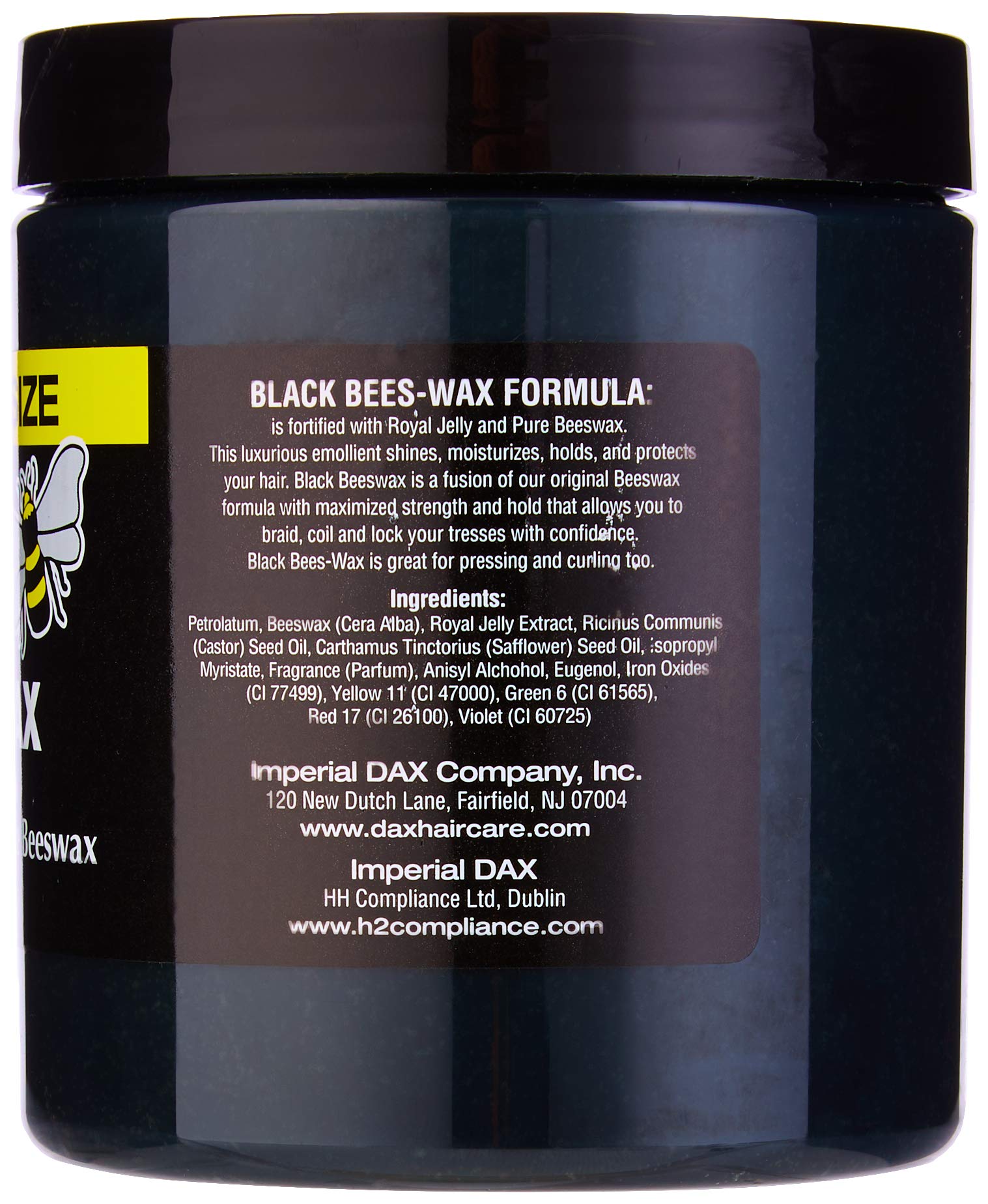 Close-up of DAX Roots Olive Cream texture ready to nourish and soften hair.
