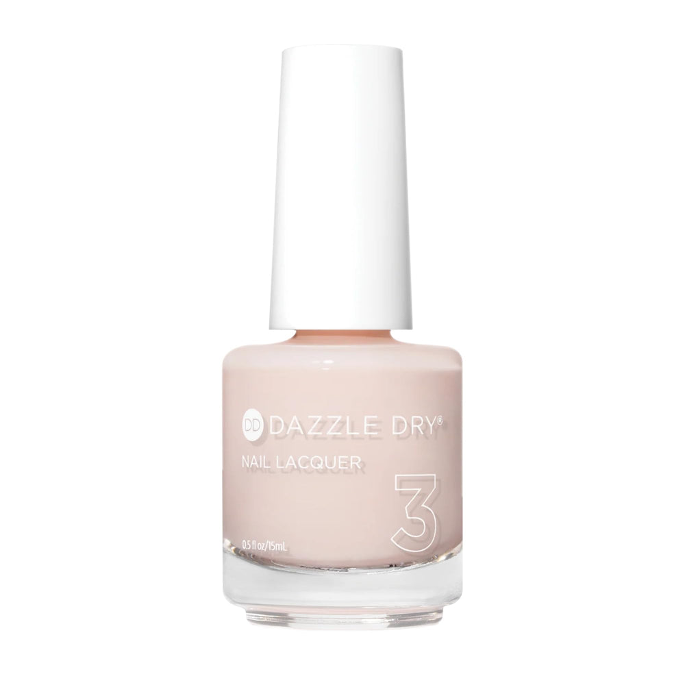 Dazzle Dry Rose Quartz bottle shows a soft peach-rose tint for a subtle manicure.