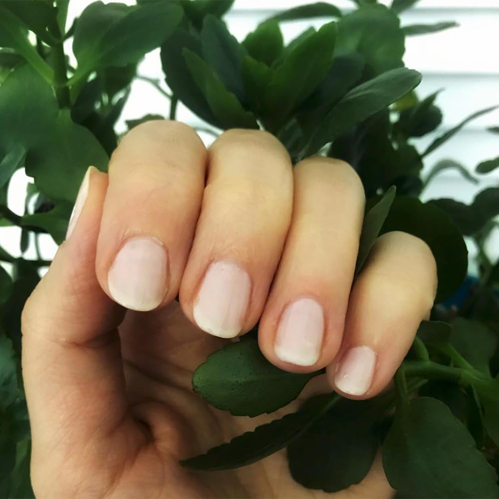 Dazzle Dry Rose Quartz nail application captures smooth, even color for a polished look.