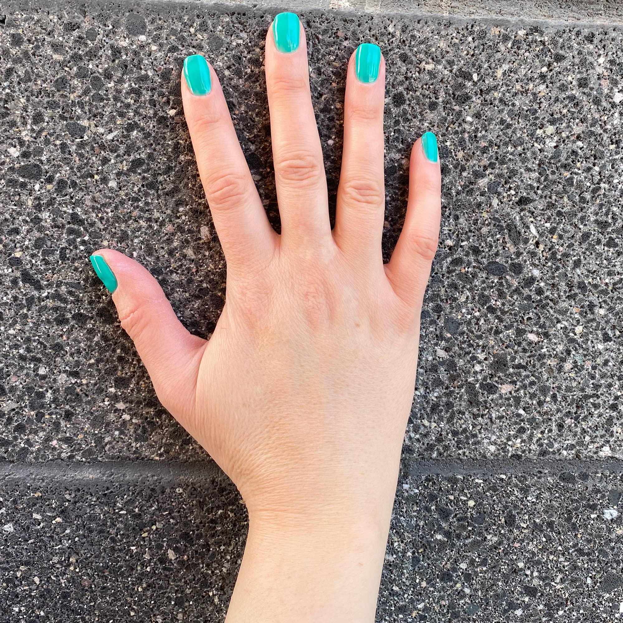 Dazzle Dry Step3 nail lacquer semi-sheer cream app focuses on precise brush strokes.